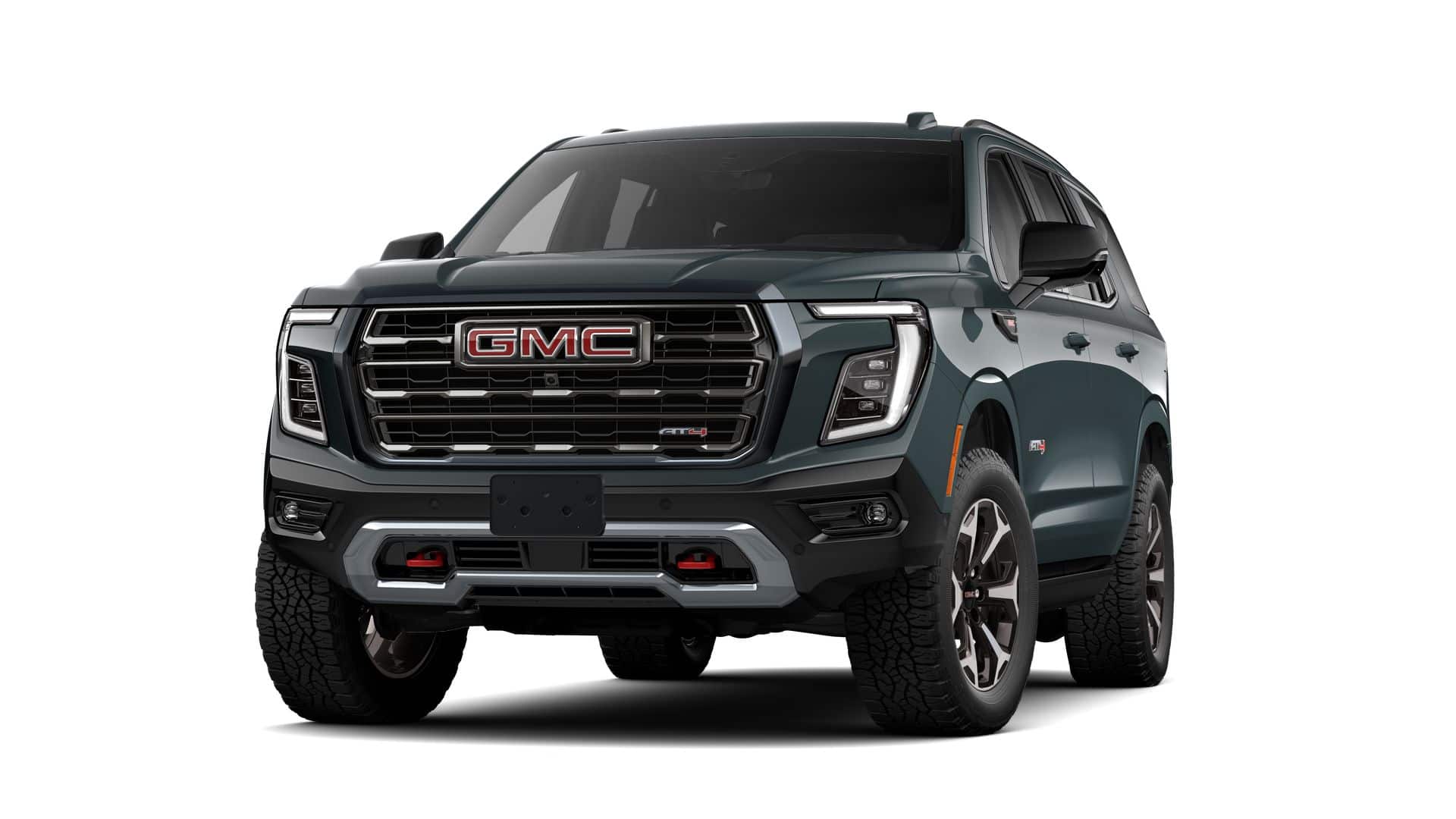 2026 GMC Yukon AT4 Ultimate in Midnight Pine — front three-quarter view
