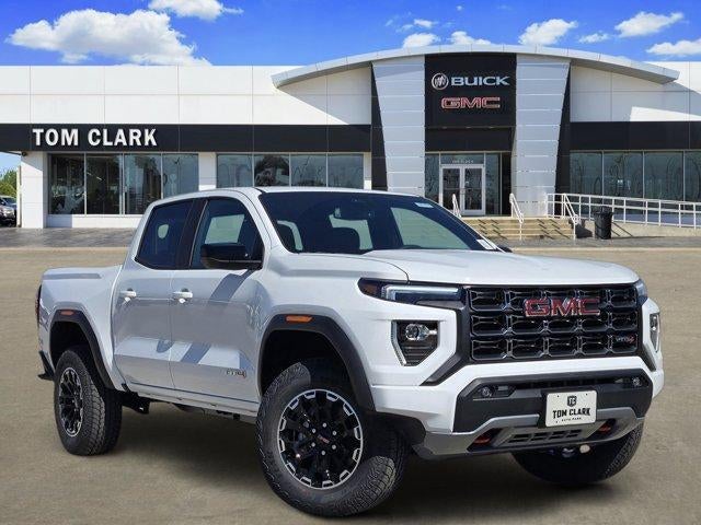 2026 GMC Canyon 4WD AT4 in Summit White — front three-quarter view