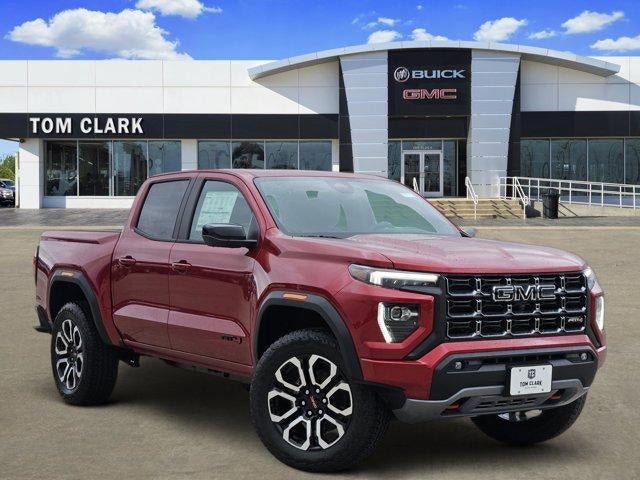 2026 GMC Canyon 4WD AT4 in Volcanic Red Tintcoat — front three-quarter view