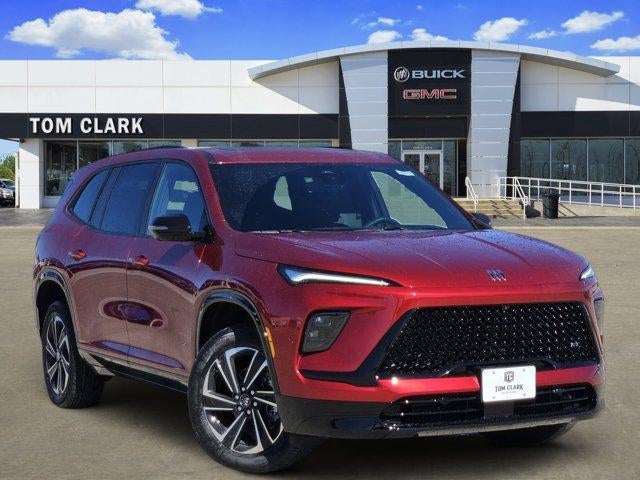 2026 Buick Enclave Sport Touring in Cherry Red Tintcoat — front three-quarter view